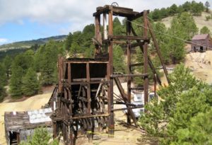 Wooden mine structure and old building at gold mine